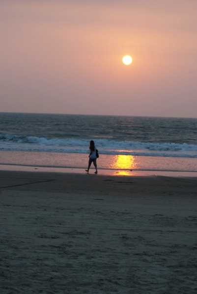 girl walking at sunset