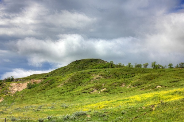 heavy clouds over the hilltop at white butte north dakota