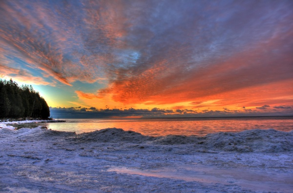 icy lakeshore at dawn at whitefish dunes state park wisconsin