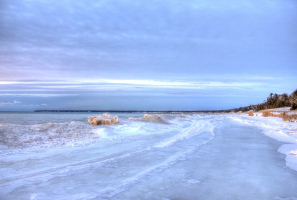 icy shore at whitefish dunes state park wisconsin