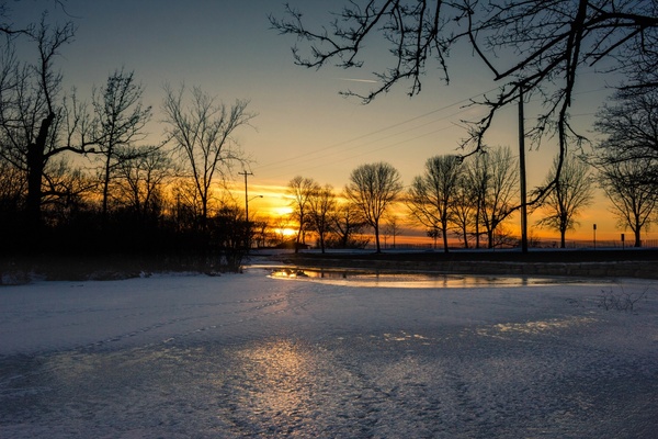 icy sunset at tenney park in madison wisconsin