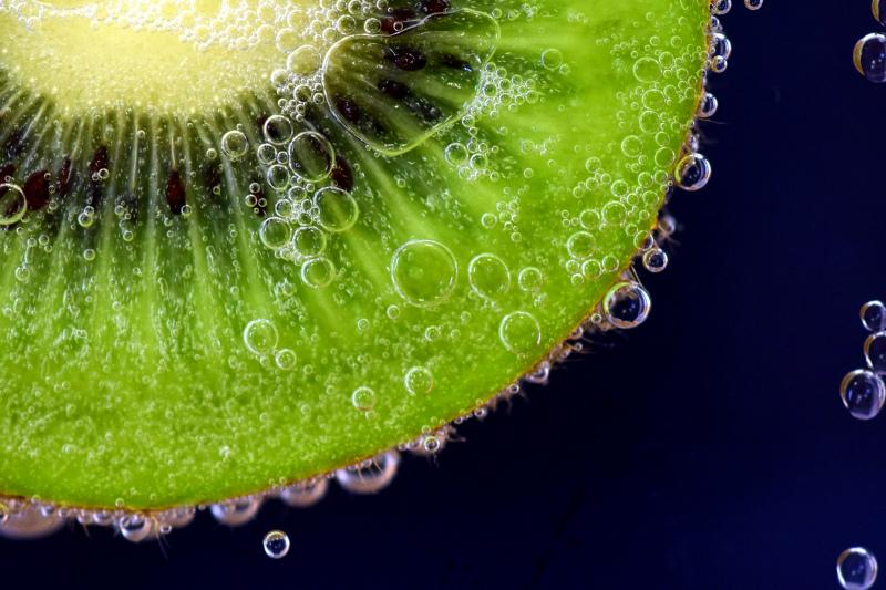kiwi slice backdrop elegant contrast closeup 