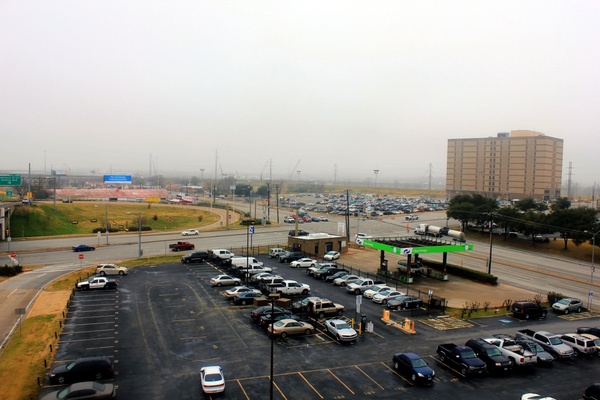 large parking lot on foggy day in dallas texas