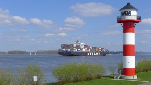 lighthouse container ship river