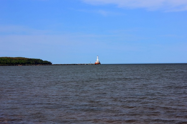 lighthouse in the distance in mclain state park michigan 