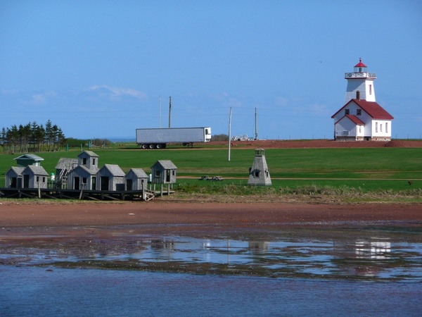 lighthouse old fishing huts shoreline