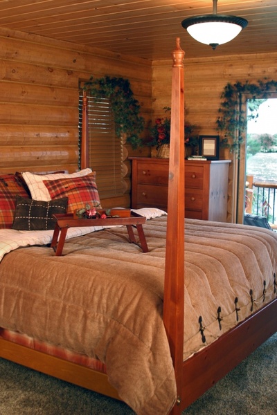 log home master bedroom bed
