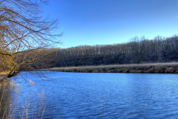 looking across the river and landscape at backbone state park iowa