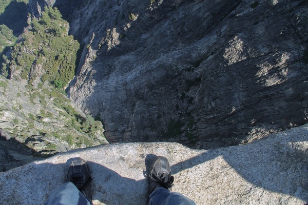 looking down at feet on edge of cliff