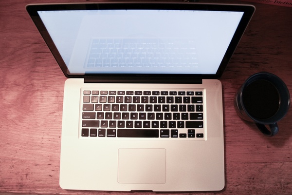 macbook laptop top view with coffee mug