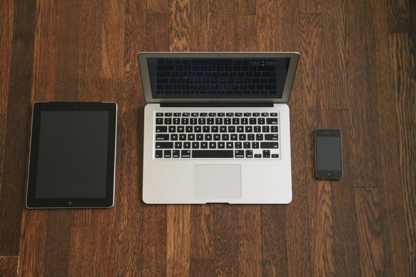 macbook with ipad 038 iphone on wood desk