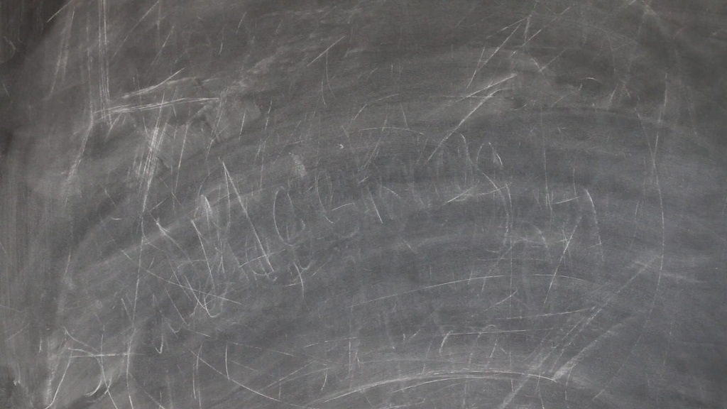 man taking note time on black board