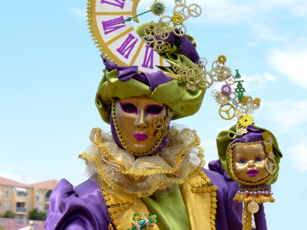 performer with golden masks and colorful costume 