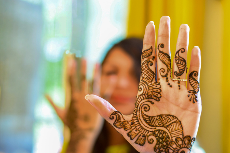 mehndi design closeup blurred decorated hands