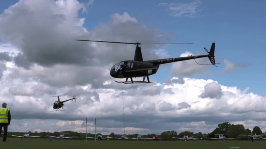 modern helicopter flying in airshow