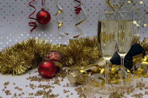 christmas celebration with baubles and wine glasses