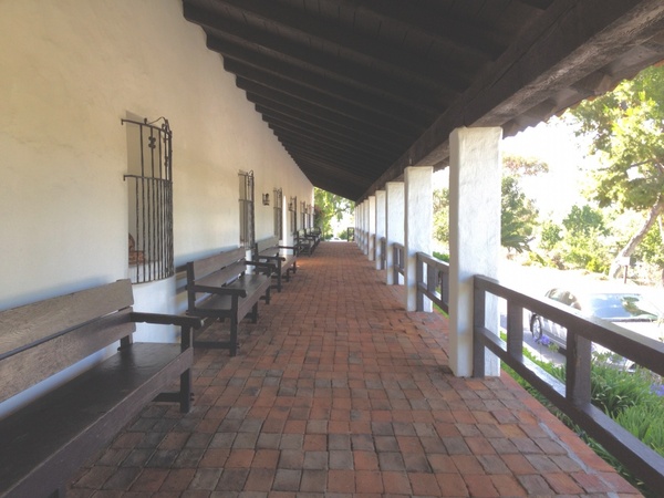 outdoor hallway of mission building