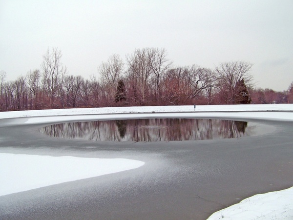 partially frozen pond