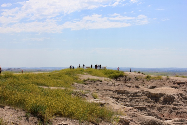 people overlooking the landscape at badlands national park south dakota