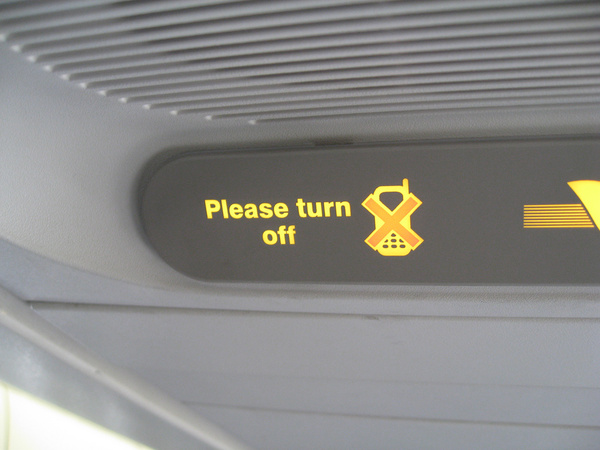 please turn off your mobile sign in an airplane