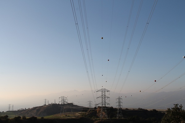 power lines on towers on hills
