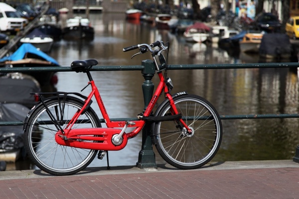 red bicycle on bridge