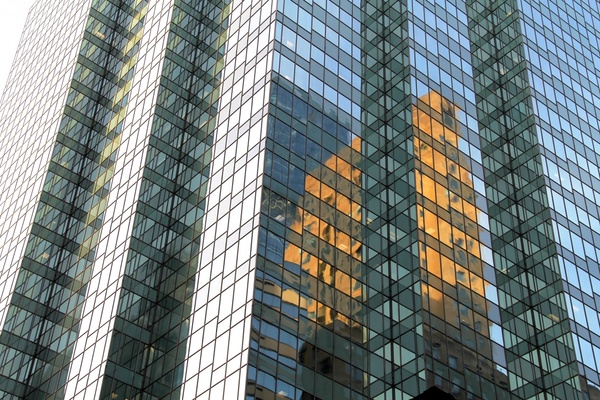 reflections in tall all glass building
