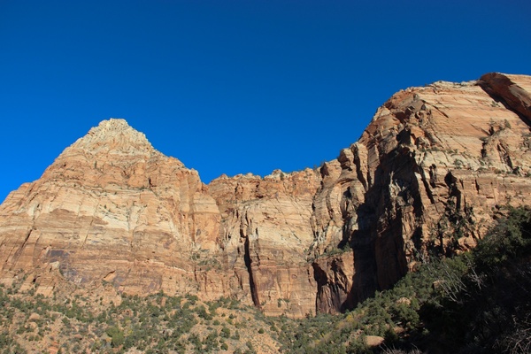 rock mountain cliffs on clear blue sky