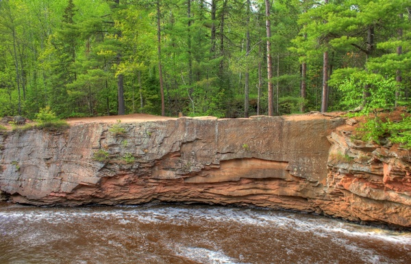 rocks on the opposite shore at amnicon falls state park wisconsin 