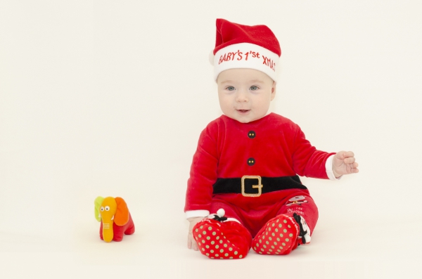 cute baby in santa claus clothing 