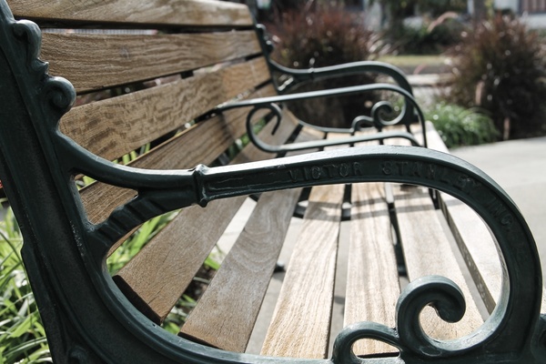 side of a park bench armrest