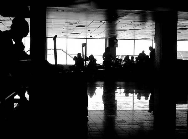 silhouette of people at airport terminal