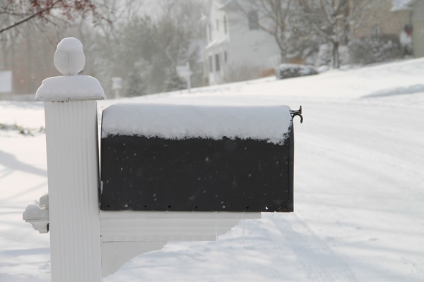 snow covered mailbox in neighborhood 