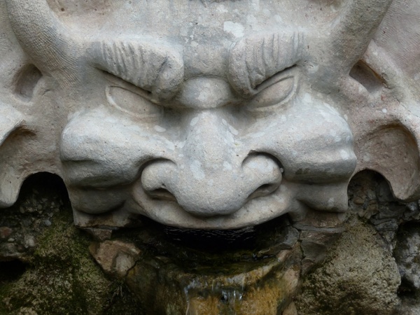 stone figure devil grim