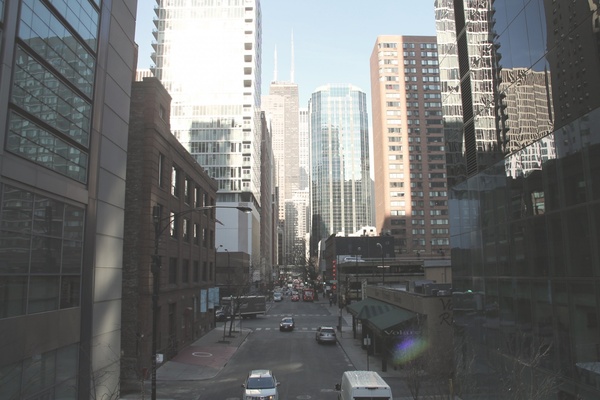street between tall buildings in downtown city