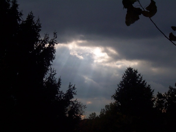 sun rays through dark clouds