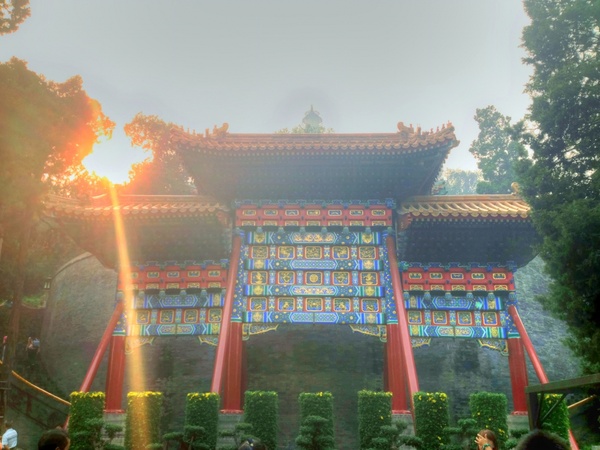 sun shining on pavillion in beijing china