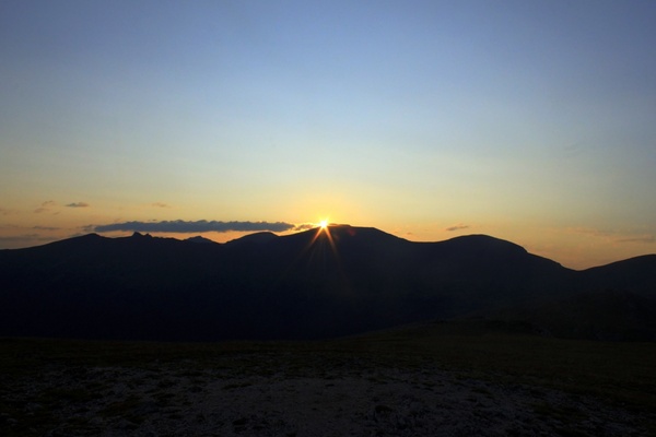 sunrise in the distance at rocky mountains national park colorado 
