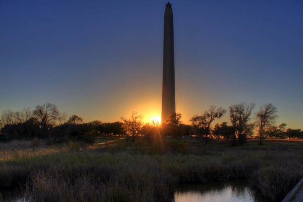 sunset behind monument at san jacinto monument texas 