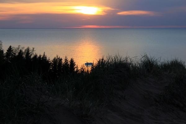 sunset over lake and forest at pictured rocks national lakeshore michigan