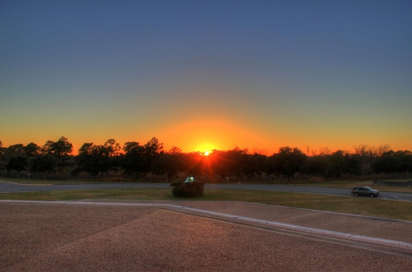 sunset over parking lot at san jacinto monument texas