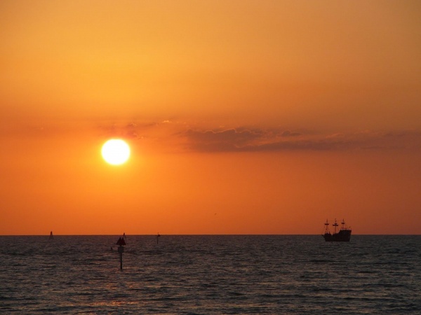 sunset ship ocean 