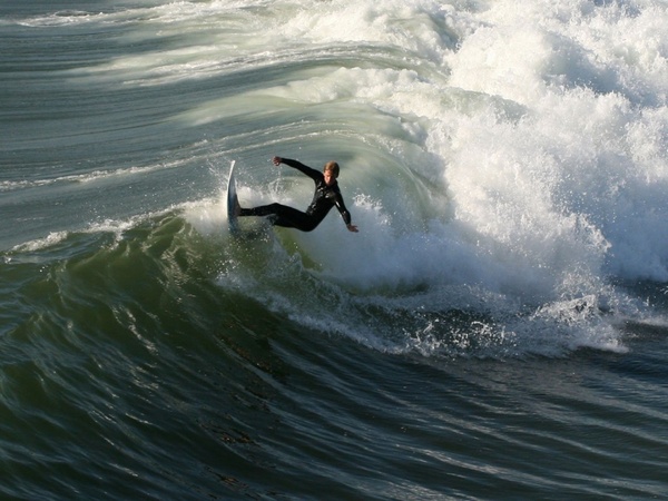 surfer surfing huntington