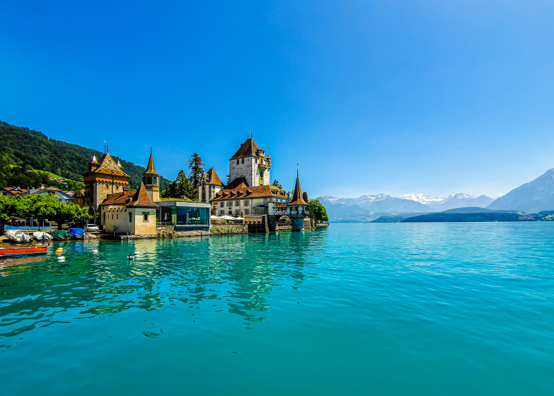 switzerland scenery picture calm river side town 