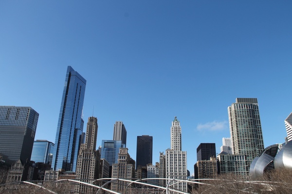tall buildings of city skyline against clear sky