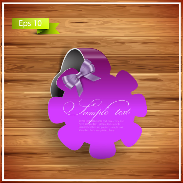 violet flower ribbon badge on wood background 