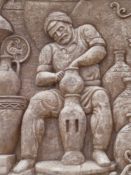 wall relief pottery man