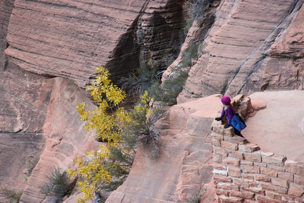 woman at viewpoint looking at cliffs