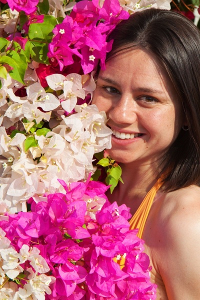 young woman surrounded with flowers