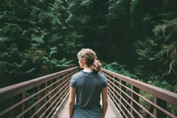 adult anticipation bridge daytime forest girl
